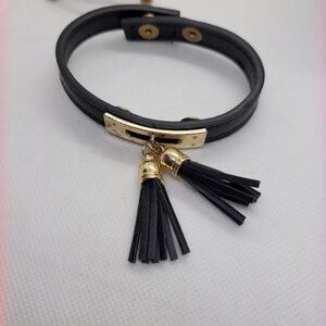 Black and Gold! Leather band with tassels.